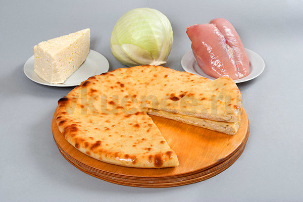 Осетинский пирог с сыром, курицей и капустой фото